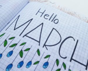 hello march printed paper on white surface